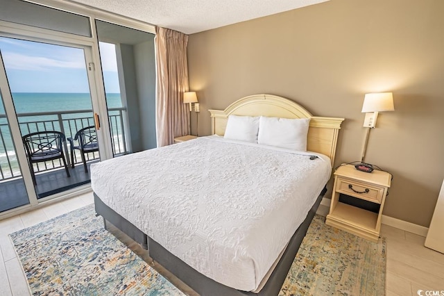 2000 N Ocean Blvd Unit 1117, Myrtle Beach, SC 29577 - bedroom with access to outside, a water view, and floor to ceiling windows