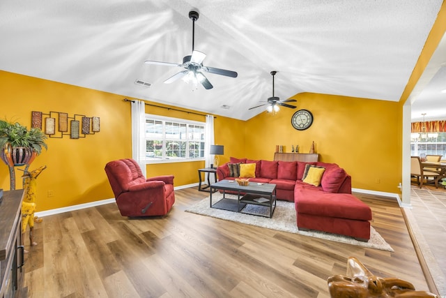 209 Chickasaw Ln, Myrtle Beach, SC 29579 - living room featuring vaulted ceiling, wood finished floors, and a ceiling fan