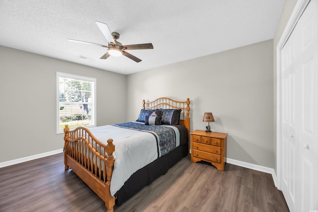 209 Chickasaw Ln, Myrtle Beach, SC 29579 - bedroom with a closet, wood finished floors, a ceiling fan, and a textured ceiling