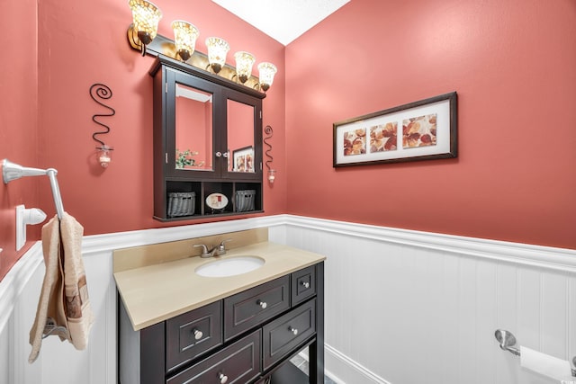 209 Chickasaw Ln, Myrtle Beach, SC 29579 - bathroom with wainscoting and vanity