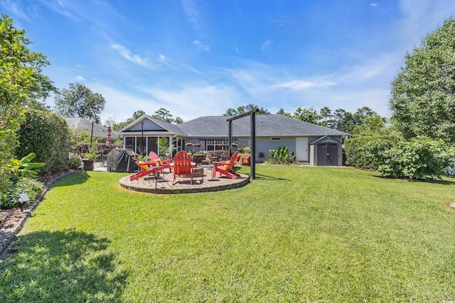 209 Chickasaw Ln, Myrtle Beach, SC 29579 - view of green lawn with a storage unit, a patio, and an outdoor fire pit