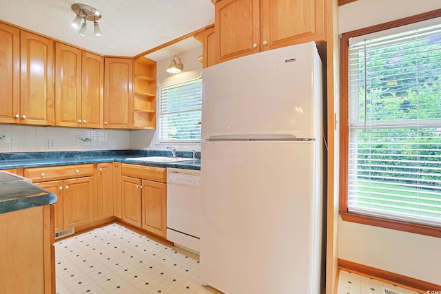 3916 Quail Cir, Myrtle Beach, SC 29579 - kitchen with white appliances, light floors, dark countertops, open shelves, and backsplash