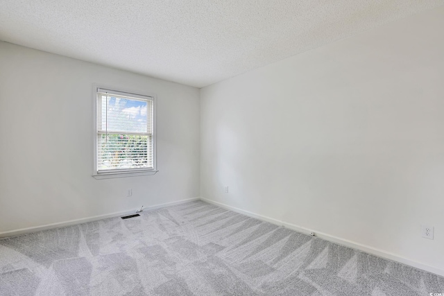 3916 Quail Cir, Myrtle Beach, SC 29579 - carpeted spare room featuring a textured ceiling and baseboards