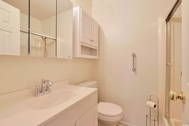 3916 Quail Cir, Myrtle Beach, SC 29579 - bathroom featuring a shower with door, vanity, and a textured ceiling