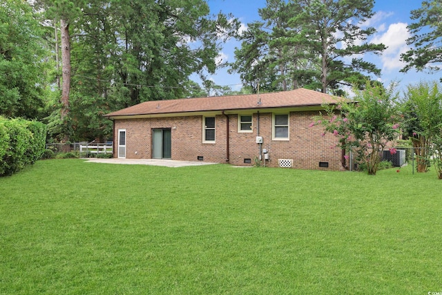 3916 Quail Cir, Myrtle Beach, SC 29579 - rear view of house featuring crawl space, a patio, a fenced backyard, brick siding, and a shingled roof