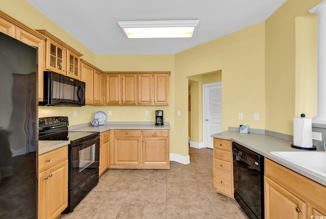 2180 Waterview Dr Unit 647, North Myrtle Beach, SC 29582 - kitchen with black appliances, light brown cabinetry, light countertops, and glass insert cabinets