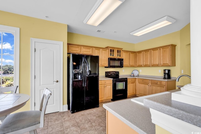 2180 Waterview Dr Unit 647, North Myrtle Beach, SC 29582 - kitchen featuring black appliances, light tile patterned floors, light brown cabinetry, glass insert cabinets, and light countertops