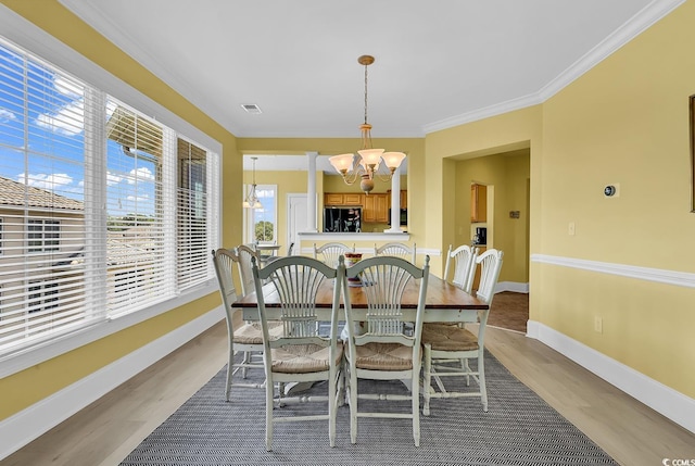 2180 Waterview Dr Unit 647, North Myrtle Beach, SC 29582 - dining area with a chandelier, wood finished floors, and ornamental molding
