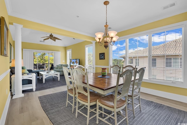 2180 Waterview Dr Unit 647, North Myrtle Beach, SC 29582 - dining room featuring light wood-type flooring, a chandelier, a ceiling fan, ornate columns, and ornamental molding