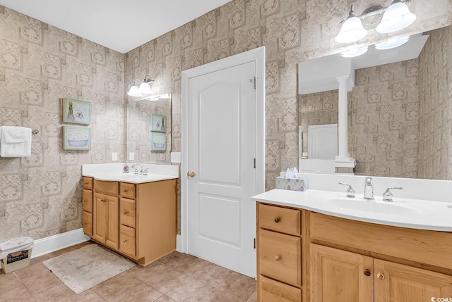 2180 Waterview Dr Unit 647, North Myrtle Beach, SC 29582 - full bathroom with two vanities, wallpapered walls, tile patterned flooring, and decorative columns
