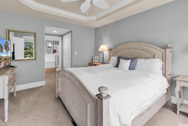 2180 Waterview Dr Unit 647, North Myrtle Beach, SC 29582 - bedroom with light colored carpet, a raised ceiling, ensuite bath, ornamental molding, and a ceiling fan