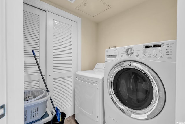2180 Waterview Dr Unit 647, North Myrtle Beach, SC 29582 - laundry area featuring washing machine and dryer and attic access