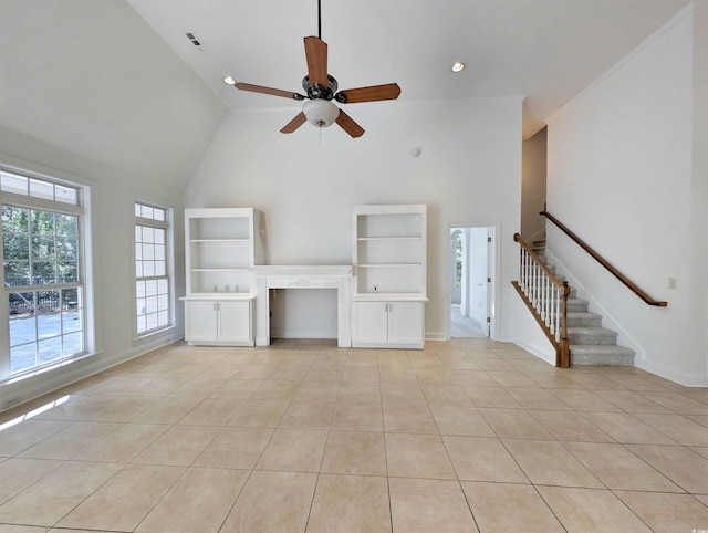 25 Deloach Trl, Pawleys Island, SC 29585 - unfurnished living room with high vaulted ceiling, a ceiling fan, light tile patterned floors, and stairway