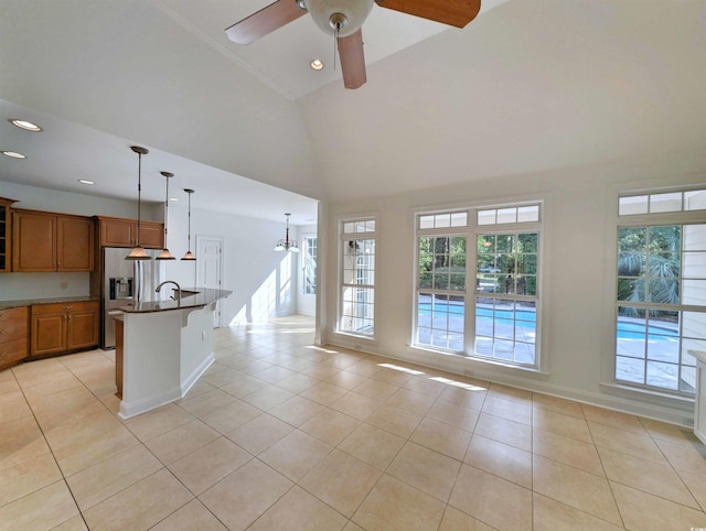 25 Deloach Trl, Pawleys Island, SC 29585 - kitchen featuring stainless steel fridge with ice dispenser, brown cabinetry, light tile patterned floors, a ceiling fan, and recessed lighting