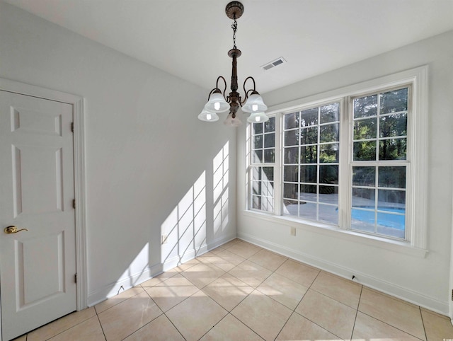 25 Deloach Trl, Pawleys Island, SC 29585 - unfurnished dining area with a chandelier and light tile patterned floors