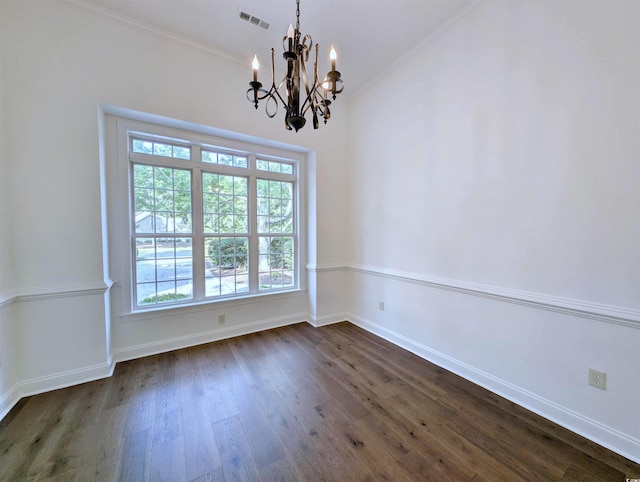 25 Deloach Trl, Pawleys Island, SC 29585 - unfurnished room featuring a chandelier, plenty of natural light, dark wood-style floors, and crown molding