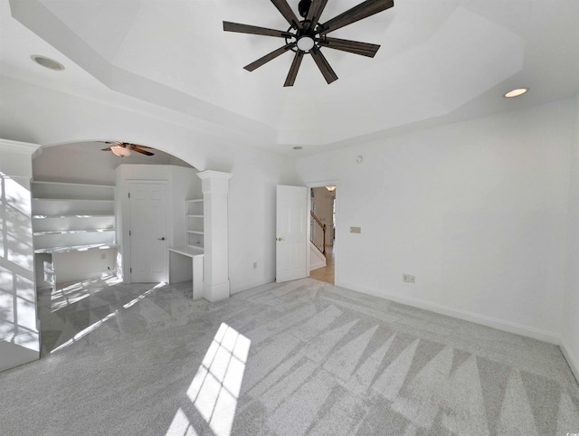 25 Deloach Trl, Pawleys Island, SC 29585 - spare room with ceiling fan, carpet flooring, arched walkways, a raised ceiling, and decorative columns