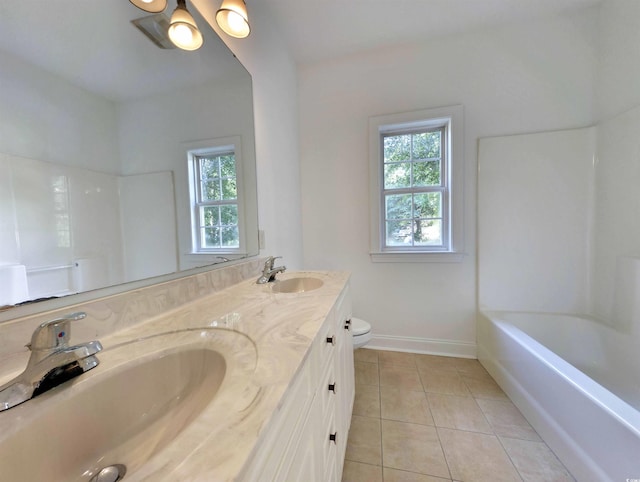 25 Deloach Trl, Pawleys Island, SC 29585 - bathroom with plenty of natural light, tile patterned floors, double vanity, and bathing tub / shower combination