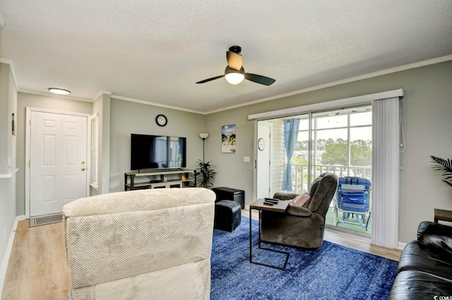 2187 Clearwater Dr Unit H, Surfside Beach, SC 29575 - living area with a ceiling fan, wood finished floors, crown molding, and a textured ceiling