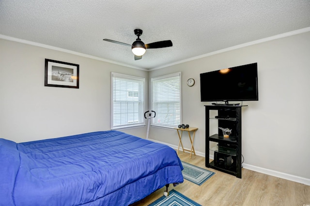 2187 Clearwater Dr Unit H, Surfside Beach, SC 29575 - bedroom with wood finished floors, a textured ceiling, ceiling fan, and ornamental molding