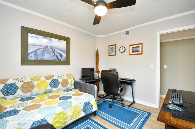 2187 Clearwater Dr Unit H, Surfside Beach, SC 29575 - bedroom featuring wood finished floors, an office area, ornamental molding, a textured ceiling, and ceiling fan