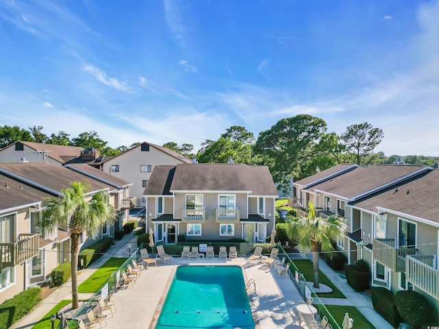 405 77th Ave N Unit 5, Myrtle Beach, SC 29572 - community pool featuring a residential view and a patio area