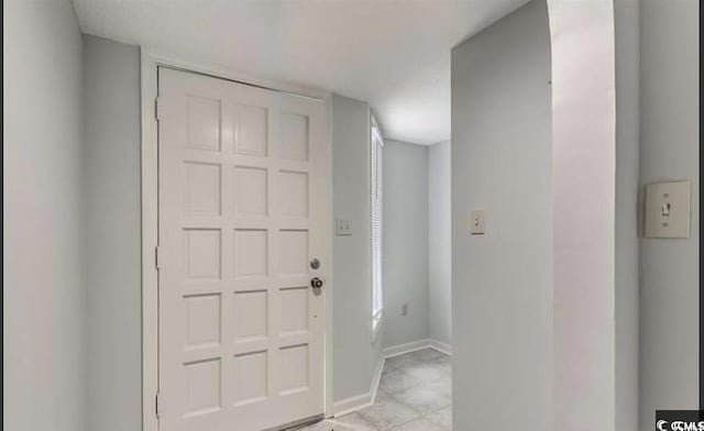 405 77th Ave N Unit 5, Myrtle Beach, SC 29572 - foyer with baseboards and light tile patterned floors
