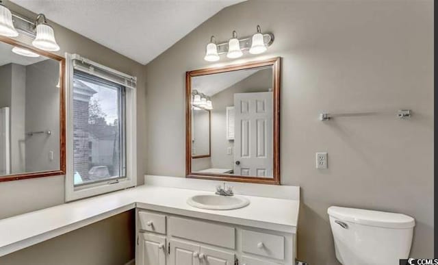 405 77th Ave N Unit 5, Myrtle Beach, SC 29572 - bathroom featuring vanity and lofted ceiling