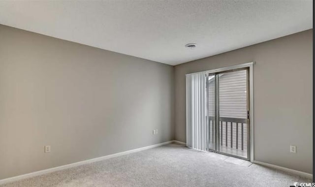 405 77th Ave N Unit 5, Myrtle Beach, SC 29572 - carpeted spare room featuring baseboards and a textured ceiling