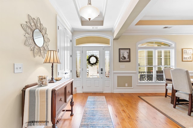 60 Springtime Ct, Murrells Inlet, SC 29576 - entrance foyer with light wood-style floors, healthy amount of natural light, crown molding, and a tray ceiling
