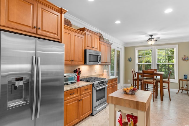60 Springtime Ct, Murrells Inlet, SC 29576 - kitchen featuring stainless steel appliances, ornamental molding, a ceiling fan, tasteful backsplash, and recessed lighting