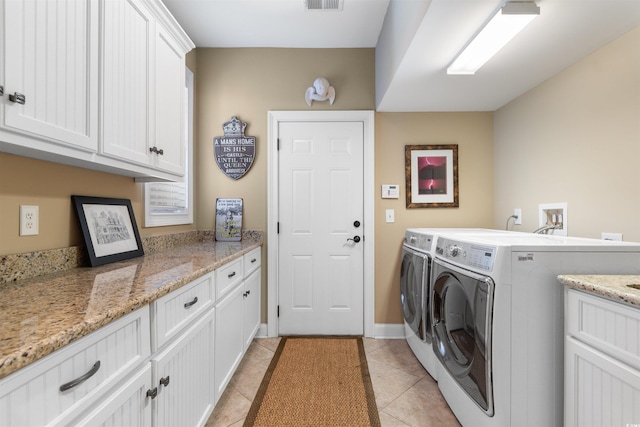 60 Springtime Ct, Murrells Inlet, SC 29576 - laundry room with washer and dryer, cabinet space, and light tile patterned floors