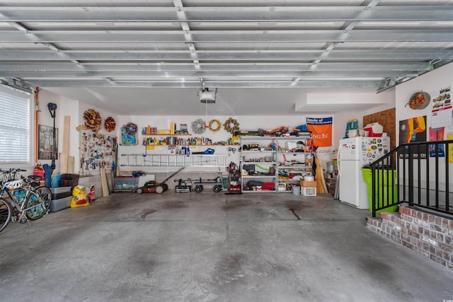 60 Springtime Ct, Murrells Inlet, SC 29576 - garage with freestanding refrigerator and a garage door opener