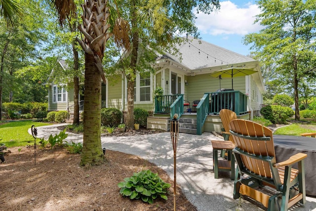 60 Springtime Ct, Murrells Inlet, SC 29576 - rear view of property featuring a patio, roof with shingles, and a wooden deck