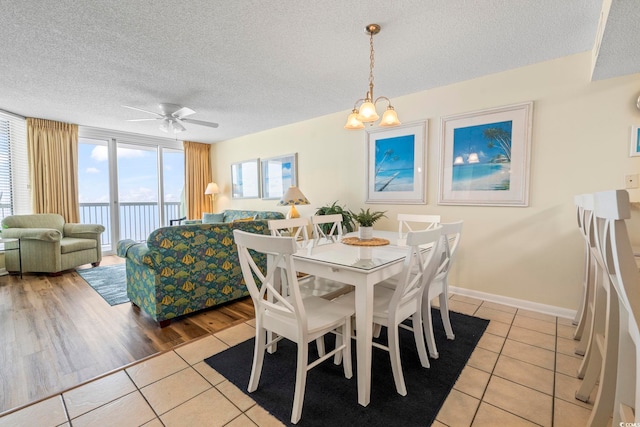 5310 N Ocean Blvd Unit 7C, North Myrtle Beach, SC 29582 - dining space featuring light tile patterned floors, a textured ceiling, and ceiling fan