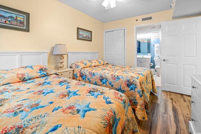 5310 N Ocean Blvd Unit 7C, North Myrtle Beach, SC 29582 - bedroom featuring light wood-style floors, ensuite bath, and a ceiling fan
