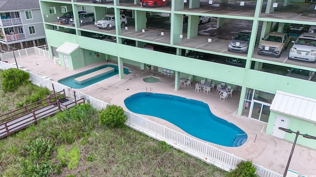 5310 N Ocean Blvd Unit 7C, North Myrtle Beach, SC 29582 - community pool with a fenced backyard and a patio