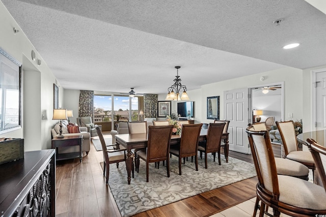 2151 Bridgeview Ct Unit 3-404, North Myrtle Beach, SC 29582 - dining area featuring a ceiling fan, a textured ceiling, and wood finished floors