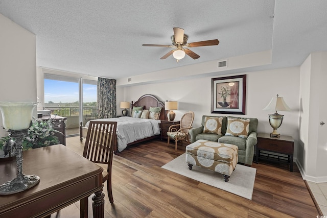 2151 Bridgeview Ct Unit 3-404, North Myrtle Beach, SC 29582 - bedroom with access to outside, a textured ceiling, wood finished floors, and ceiling fan