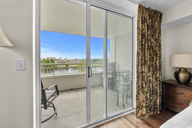 2151 Bridgeview Ct Unit 3-404, North Myrtle Beach, SC 29582 - bedroom with a water view and wood finished floors