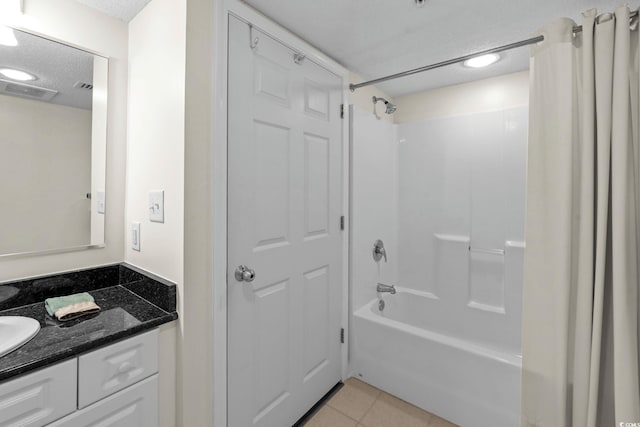 2151 Bridgeview Ct Unit 3-404, North Myrtle Beach, SC 29582 - bathroom with a textured ceiling, shower / bath combination with curtain, vanity, and tile patterned flooring