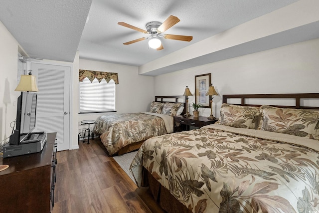 2151 Bridgeview Ct Unit 3-404, North Myrtle Beach, SC 29582 - bedroom with wood finished floors, a textured ceiling, and a ceiling fan