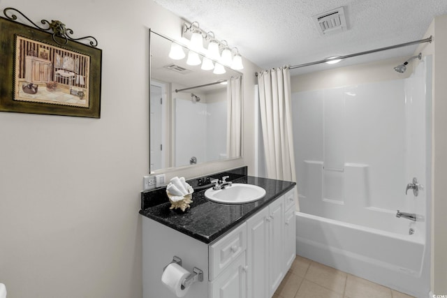 2151 Bridgeview Ct Unit 3-404, North Myrtle Beach, SC 29582 - bathroom with vanity, shower / tub combo with curtain, a textured ceiling, and tile patterned flooring