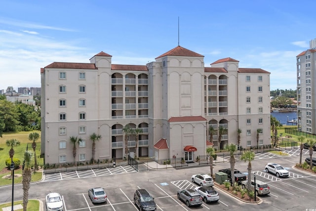 2151 Bridgeview Ct Unit 3-404, North Myrtle Beach, SC 29582 - view of building exterior with uncovered parking