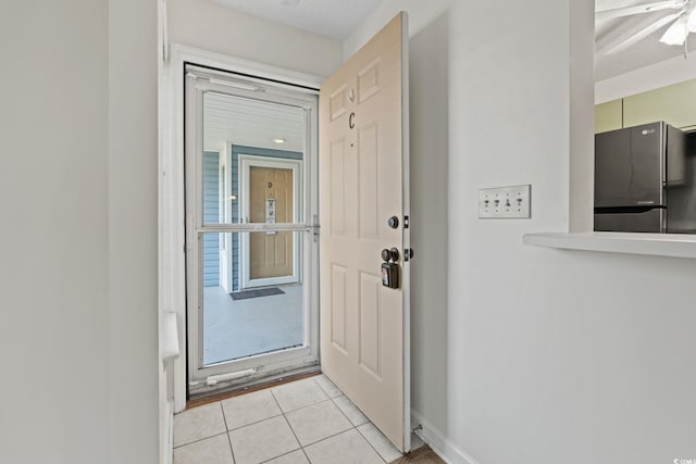 2122 Clearwater Dr Unit C, Surfside Beach, SC 29575 - doorway to outside with light tile patterned flooring and a ceiling fan