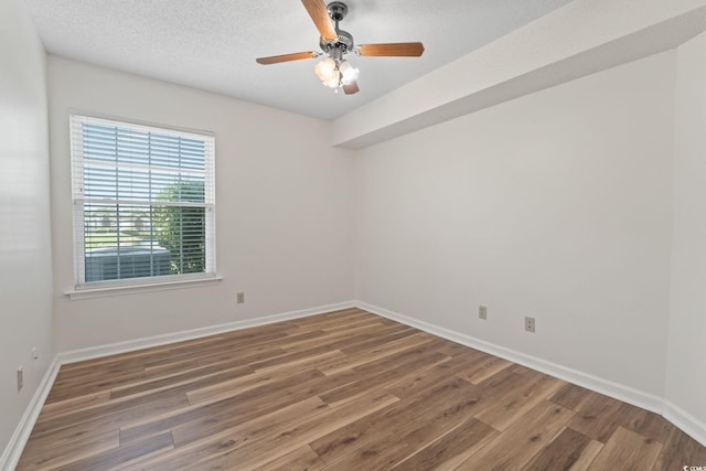 2122 Clearwater Dr Unit C, Surfside Beach, SC 29575 - spare room featuring wood finished floors and a ceiling fan