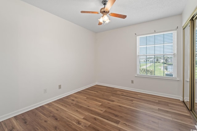 2122 Clearwater Dr Unit C, Surfside Beach, SC 29575 - unfurnished room with wood finished floors and ceiling fan