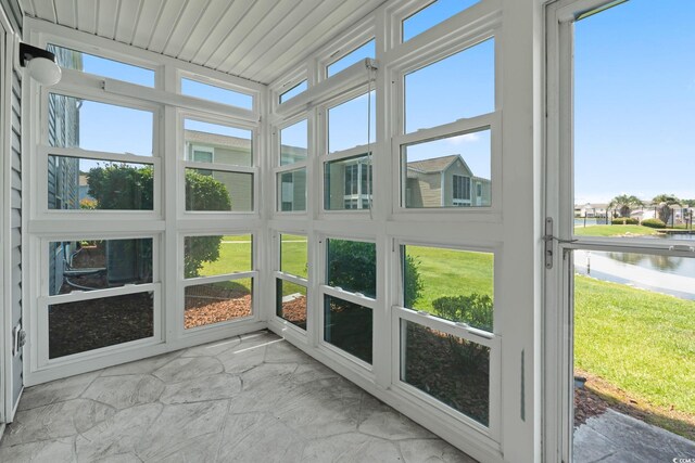 2122 Clearwater Dr Unit C, Surfside Beach, SC 29575 - unfurnished sunroom with a water view and healthy amount of natural light