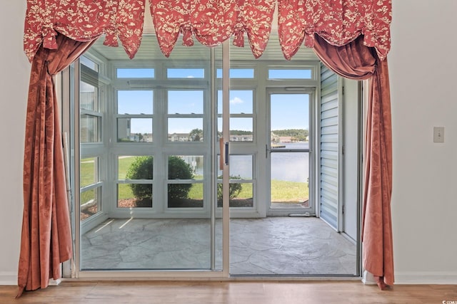 2122 Clearwater Dr Unit C, Surfside Beach, SC 29575 - doorway to outside with a water view and wood finished floors