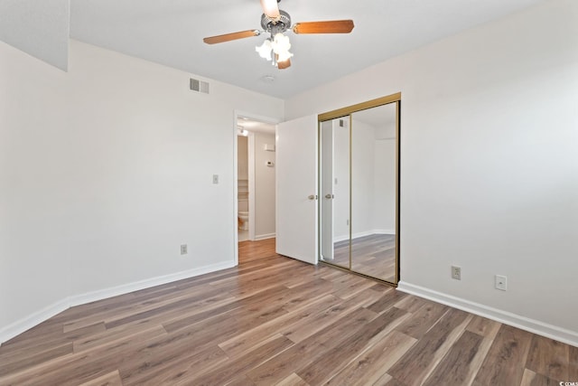 2122 Clearwater Dr Unit C, Surfside Beach, SC 29575 - unfurnished bedroom featuring light wood finished floors, a closet, and ceiling fan